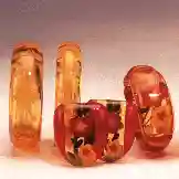 Several amber colored bracelets made of Bakelite